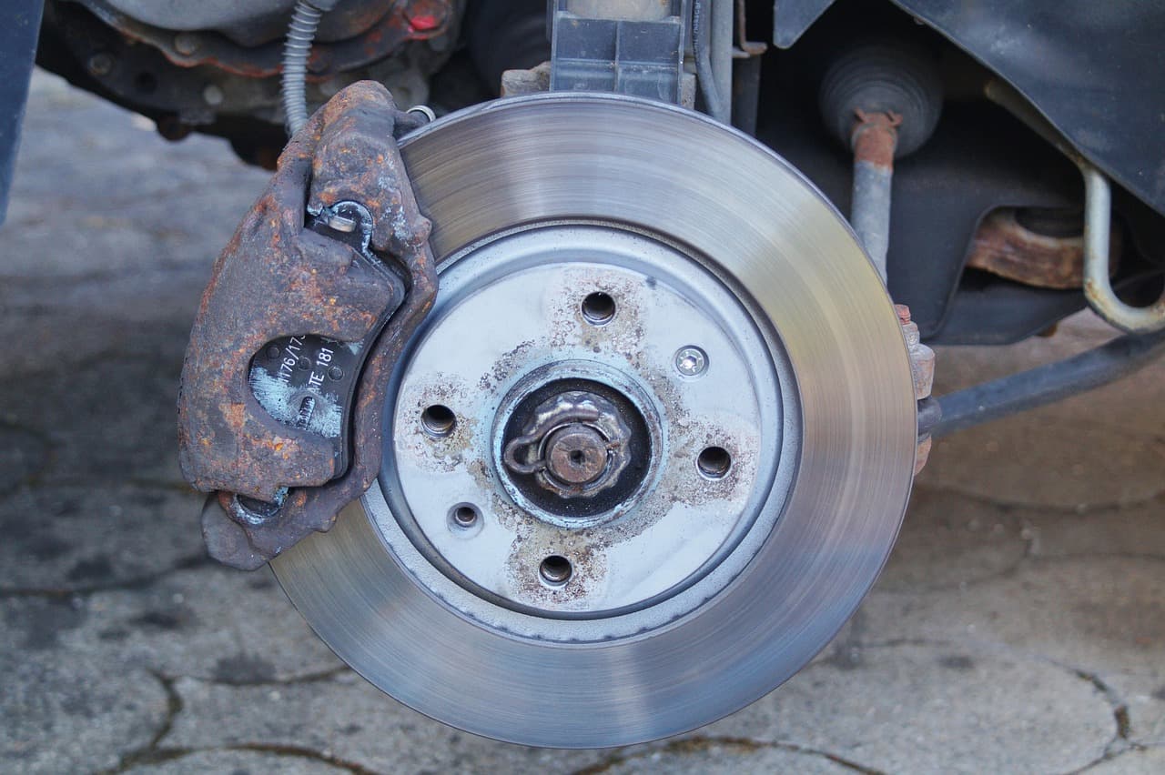 A brake disc with the calliper off, mid-job