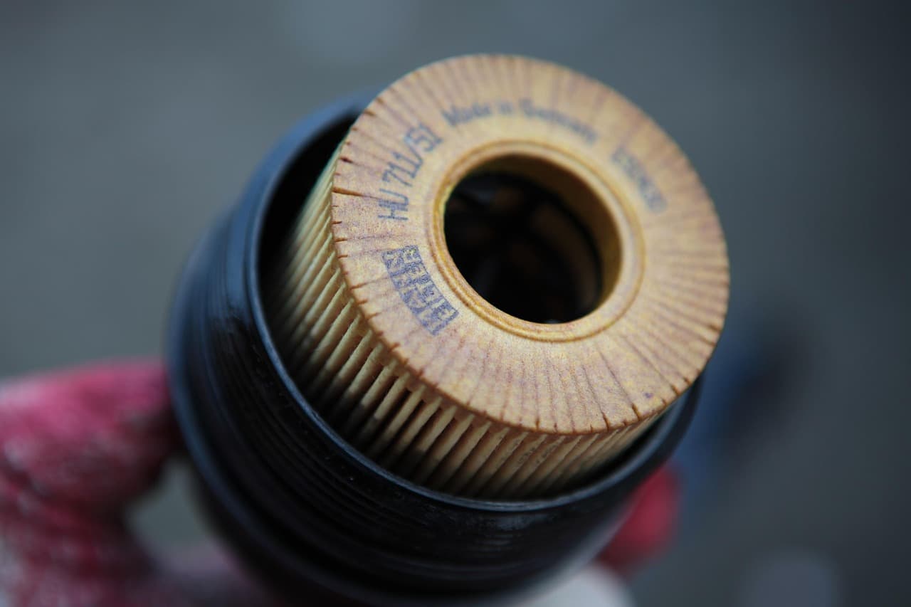 A used oil filter held up during a service