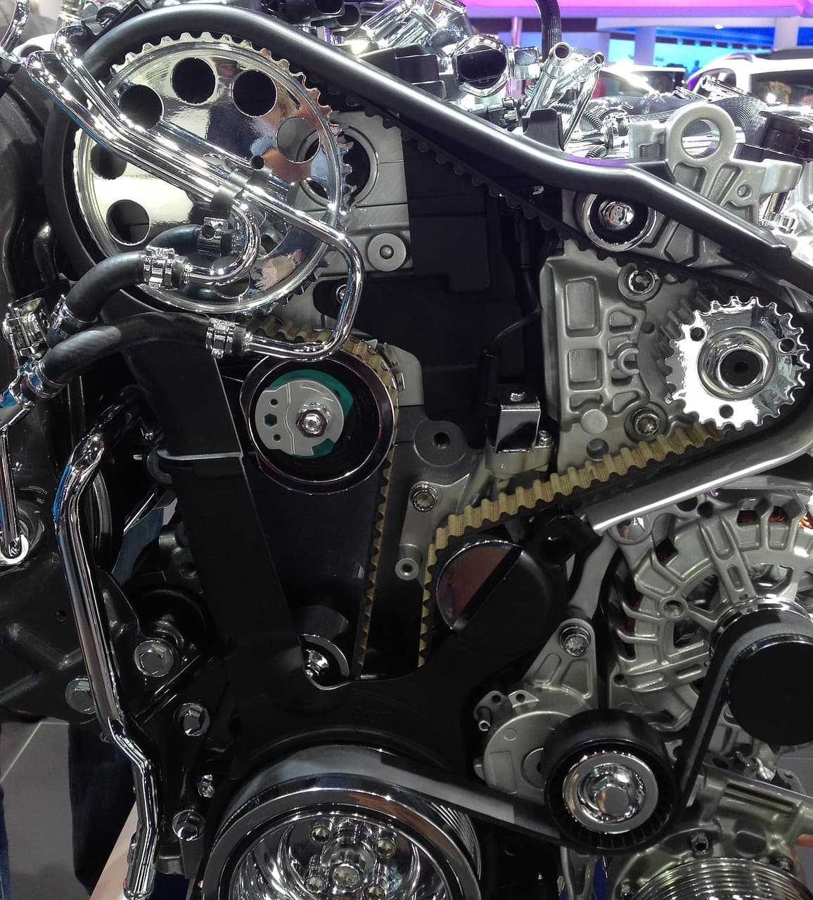 A timing belt and pulleys on a clean engine